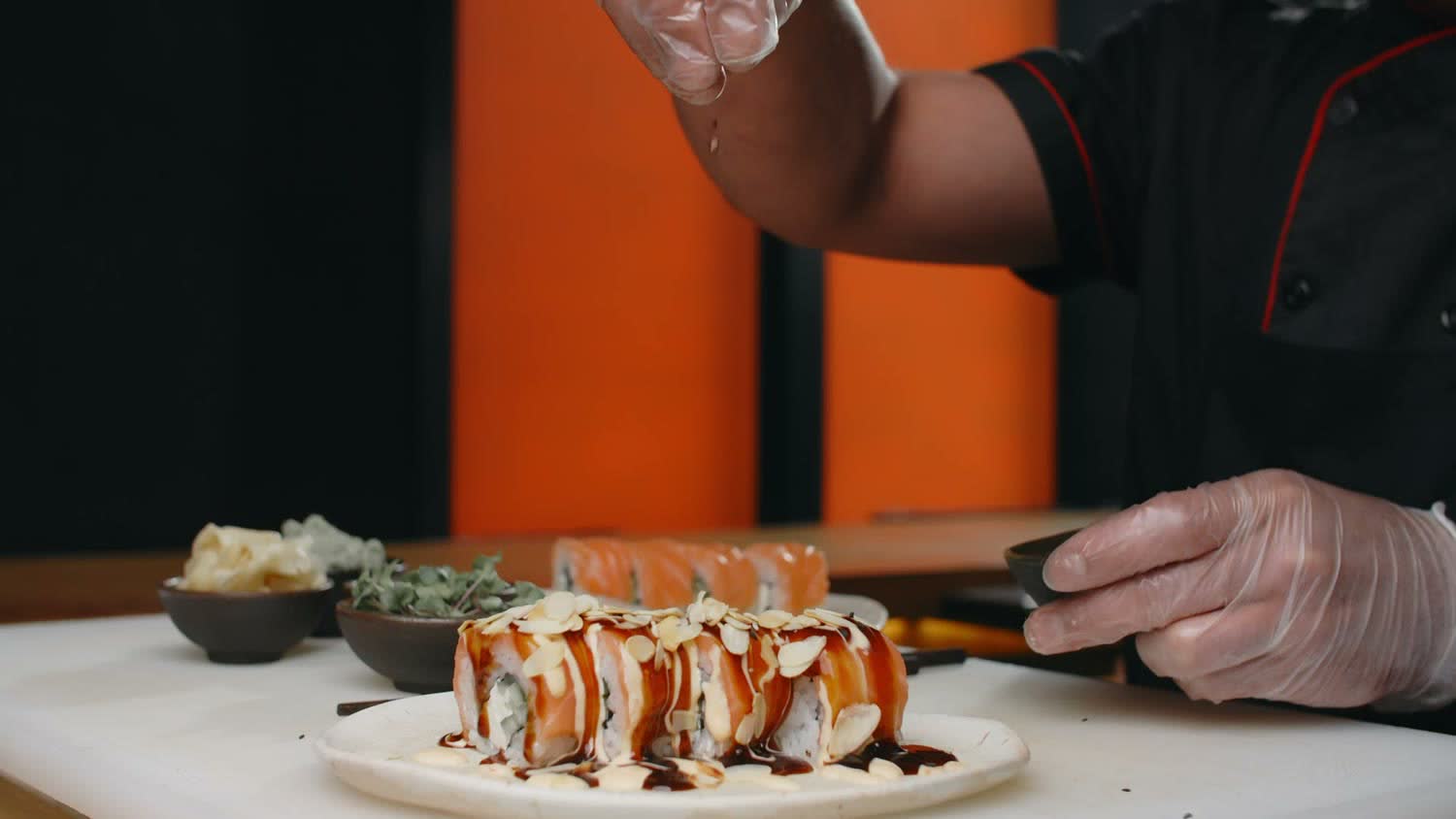 A Mahina chef plating a fresh roll
